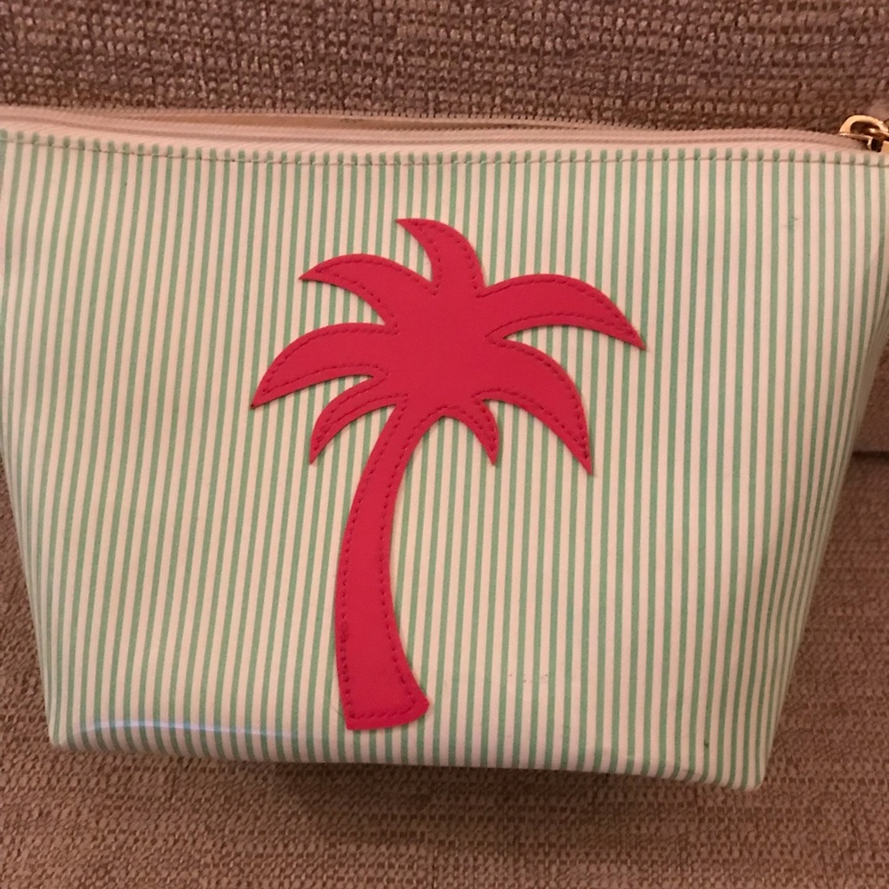 Green an white striped cosmetic bag